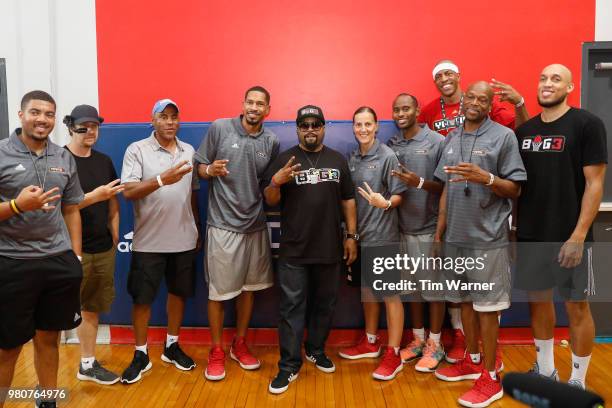 Rap Artist Ice Cube poses for a photo with staff members during the Young3 Basketball Clinic and Tournament on June 21, 2018 in Houston, Texas.