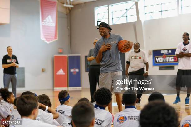 James Hollywood Robinson talks with participants during the Young3 Basketball Clinic and Tournament on June 21, 2018 in Houston, Texas.