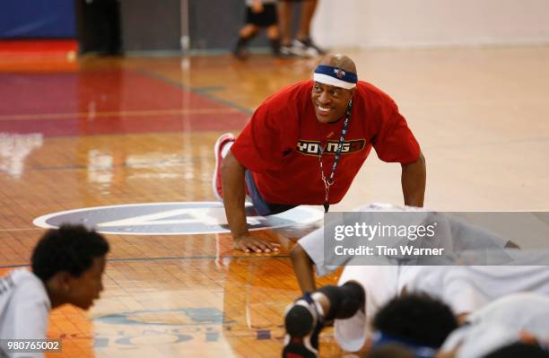 Jerome Williams does pushups with the participants during the Young3 Basketball Clinic and Tournament on June 21, 2018 in Houston, Texas.