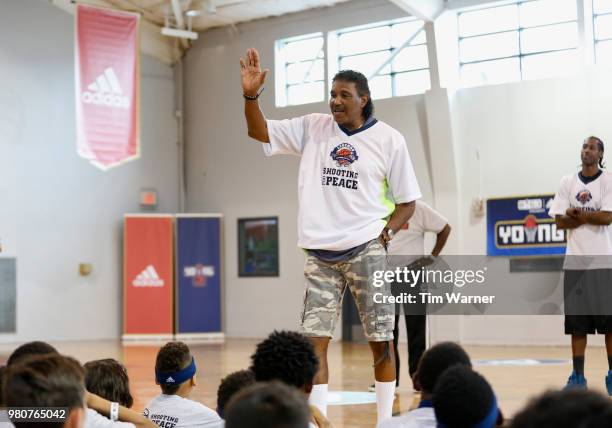 Former Houston Rocket Robert Reid talks with participants during the Young3 Basketball Clinic and Tournament on June 21, 2018 in Houston, Texas.