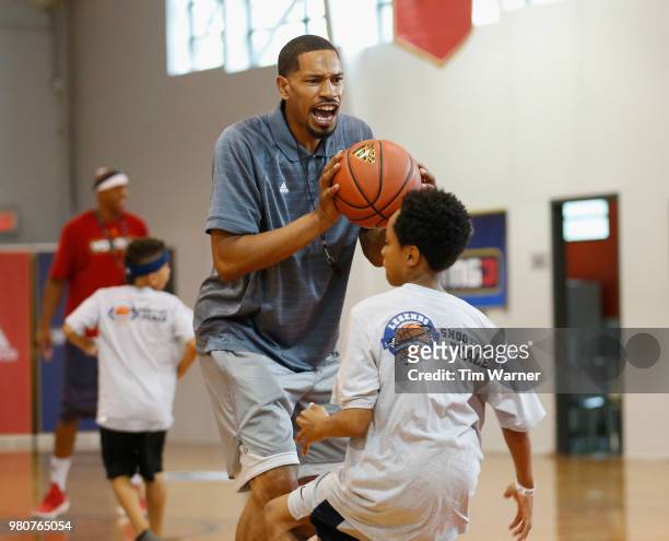 Coach Desmon Farmer gives instruction during the Young3 Basketball Clinic and Tournament on June 21, 2018 in Houston, Texas.