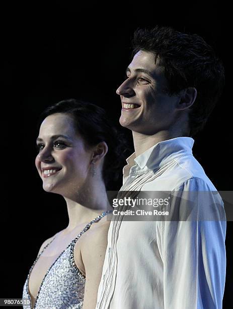 Tessa Virtue and Scott Moir of Canada look on from the podium after the Ice Dance Free Dance during the 2010 ISU World Figure Skating Championships...