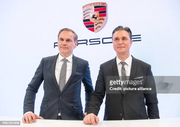 March 2018, Germany, Stuttgart: Oliver Blume , chairman of the Porsche AG, and Lutz Meschke, Deputy Chairman and board member of finance and IT,...