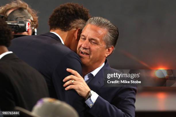 Kevin Knox reacts with head coach John Calipari of the Kentucky Wildcats after being drafted ninth overall by the New York Knicks during the 2018 NBA...