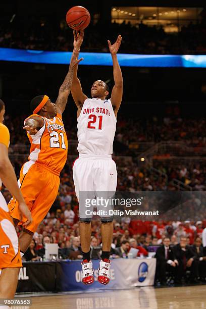 Evan Turner of the Ohio State Buckeyes shoots the ball against Melvin Goins of the Tennessee Volunteers during the midwest regional semifinal of the...
