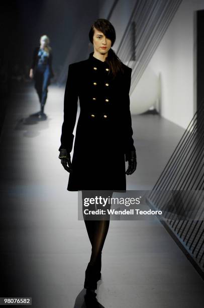 Model showcases designs on the catwalk by White Suede as part of L'Oreal Paris Runway 5 on the fourth day of the 2010 L'Oreal Melbourne Fashion...