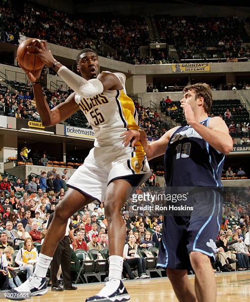 Roy Hibbert of the Indiana Pacers battles Mehmet Okur of the Utah Jazz at Conseco Fieldhouse on March 26, 2010 in Indianapolis, Indiana. NOTE TO...