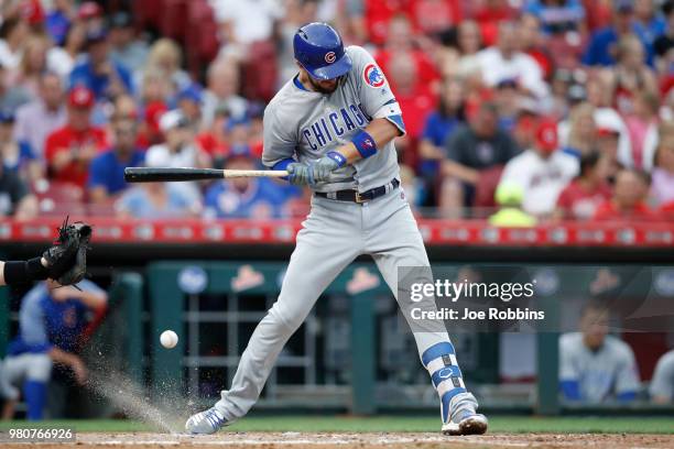 Kris Bryant of the Chicago Cubs reacts after being hit by a pitch to lead off the third inning against the Cincinnati Reds at Great American Ball...