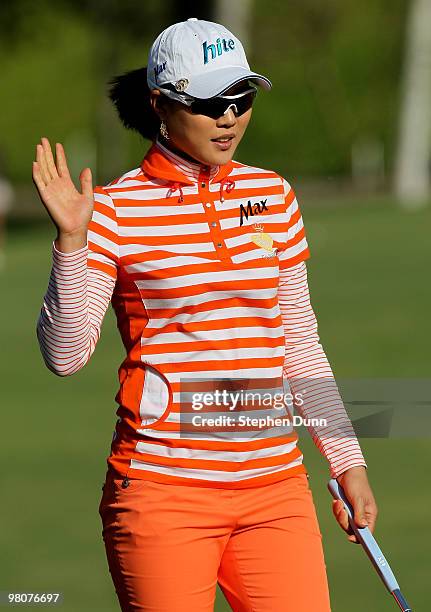 Hee Kyung Seo of South Korea waves after making a birdie putt to take sole possession of the tournament lead on the seventh hole during the second...