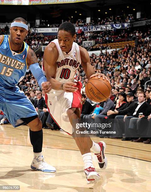 DeMar DeRozan of the Toronto Raptors looks to drive baseline past defender Carmelo Anthony of the Denver Nuggets on March 26, 2010 at the Air Canada...