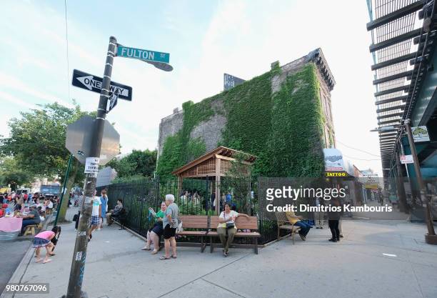 Guests attend as Michael Kors and the New York Restoration Project Celebrate The Opening Of The Essex Street Community Garden on June 21, 2018 in...