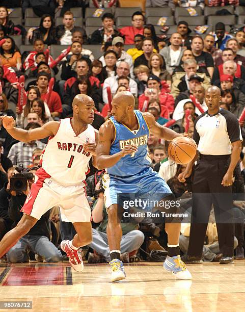 Chauncey Billups of the Denver Nuggets backs down defender Jarrett Jack of the Toronto Raptors during a game on March 26, 2010 at the Air Canada...