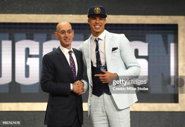 Michael Porter Jr. Poses with NBA Commissioner Adam Silver after being drafted 14th overall by the Denver Nuggets during the 2018 NBA Draft at the...
