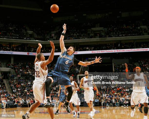 Mike Miller of the Washington Wizards battles for a loose ball with Boris Diaw of the Charlotte Bobcats on March 26, 2010 at the Time Warner Cable...