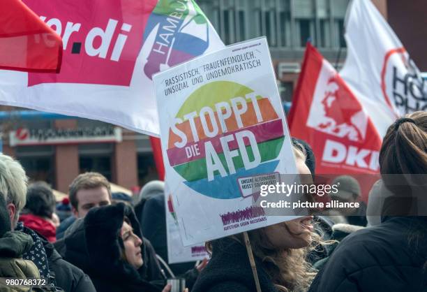 March 2018, Germany, Berlin: People at a demonstration against racism with banners and flags at Potsdamer Platz. After the initial demonstration, the...