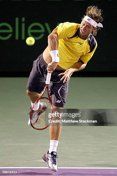 David Nalbandian serves to Viktor Troiki of Serbia during day four of the 2010 Sony Ericsson Open at Crandon Park Tennis Center on March 26, 2010 in...