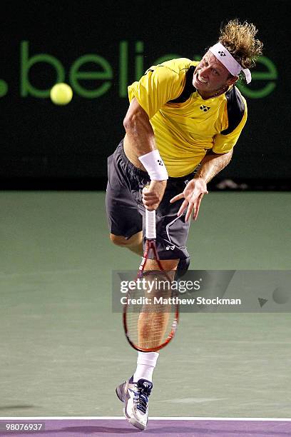 David Nalbandian serves to Viktor Troiki of Serbia during day four of the 2010 Sony Ericsson Open at Crandon Park Tennis Center on March 26, 2010 in...