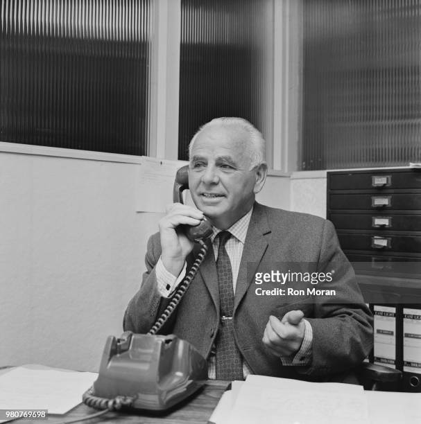 English former soccer player and manager of Bristol Rovers FC Bill Dodgin Sr speaking over the phone, UK, 12th September 1969.