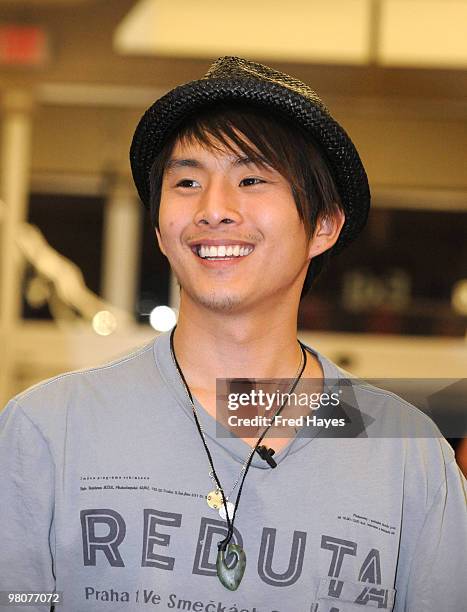 Actor Justin Chon smiles to fans at the The Twilight Saga: New Moon DVD Release Party on March 19, 2010 at the Walmart in Riverton, Utah.