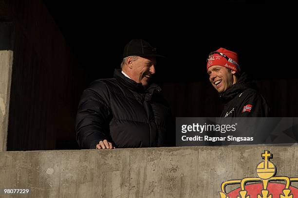 Halvard Hanevold of Norway speaks to King Harald V of Norway after the Men's 15km Mass Start race on March 21, 2010 in Holmenkollen, Norway.