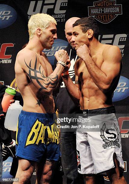Fighter Kurt Pellegrino faces off against UFC fighter Fabricio Camoes for their Lightweight fight at UFC 111: St-Pierre vs. Hardy Weigh-In on March...