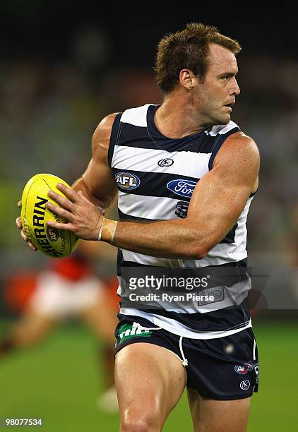 Josh Hunt of the Cats in action during the round one AFL match between the Geelong Cats and the Essendon Bombers at Melbourne Cricket Ground on March...