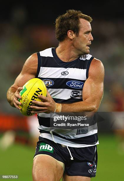 Josh Hunt of the Cats in action during the round one AFL match between the Geelong Cats and the Essendon Bombers at Melbourne Cricket Ground on March...