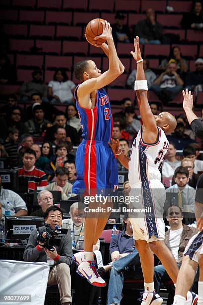 Tayshaun Prince of the Detroit Pistons shoots against Jarvis Hayes of the New Jersey Nets during a game on March 26, 2010 at Izod Center in East...