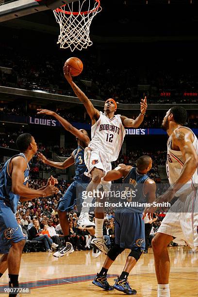 Tyrus Thomas of the Charlotte Bobcats goes for the layup against Randy Foye of the Washington Wizards on March 26, 2010 at the Time Warner Cable...