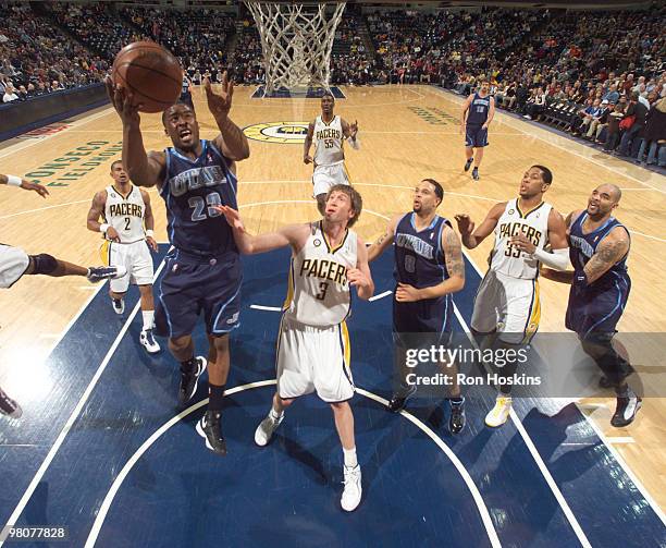 Wesley Matthews of the Utah Jazz shoots over Troy Murphy of the Indiana Pacers at Conseco Fieldhouse on March 26, 2010 in Indianapolis, Indiana. NOTE...