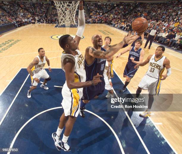 Carlos Boozer of the Utah Jazz battles Roy Hibbert of the Indiana Pacers at Conseco Fieldhouse on March 26, 2010 in Indianapolis, Indiana. NOTE TO...