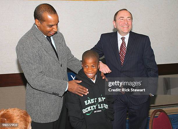 Representative Ken Martin and NHL Commissioner Gary Bettman joke with Emmanuel Bryant of Sharks Ice- Oakland, California during the 2010 Willie O'Ree...