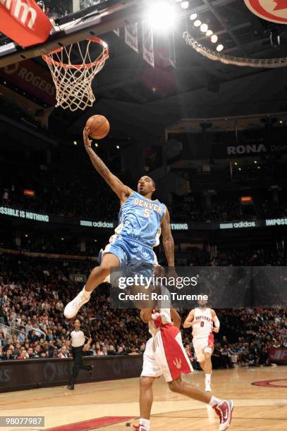 Smith of the Denver Nuggets breaks free and gets past Jarrett Jack of the Toronto Raptors for the layup during a game on March 26, 2010 at the Air...