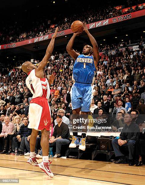 Chauncey Billups of the Denver Nuggets hits a critical 3-pointer late in the game over Jarrett Jack of the Toronto Raptors on March 26, 2010 at the...