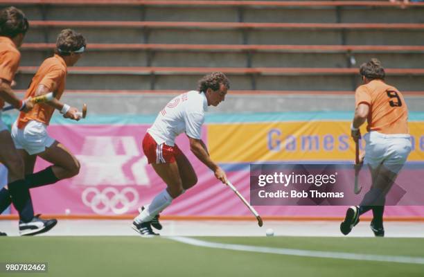 Canadian field hockey player Ross Rutledge makes a run with the ball during the pool B game between Canada and Netherlands in the Men's Field Hockey...