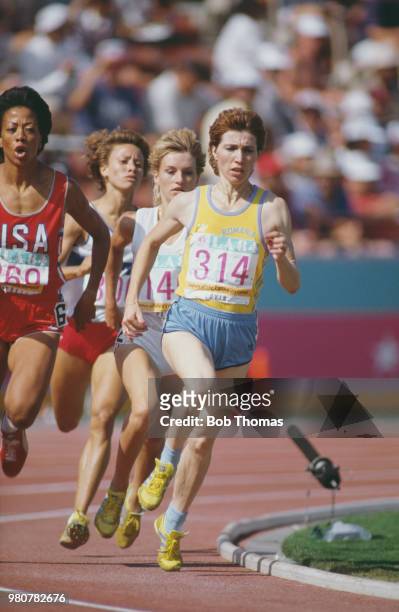 Romanian athlete Fita Lovin leads Robin Campbell of United States and Lorraine Baker of Great Britain in heat 2 of round one of the Women's 800...