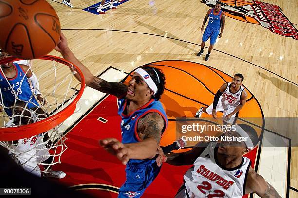 Deron Washington of the Tulsa 66ers shoots a layup against Mildon Ambres of the Idaho Stampede during the game at Qwest Arena on March 19, 2010 in...