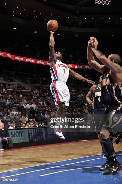 Ben Gordon of the Detroit Pistons shoots a layup against Solomon Jones and Dahntay Jones of the Indiana Pacers during the game at the Palace of...