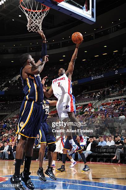 Ben Gordon of the Detroit Pistons shoots a layup against Brandon Rush and Roy Hibbert of the Indiana Pacers during the game at the Palace of Auburn...