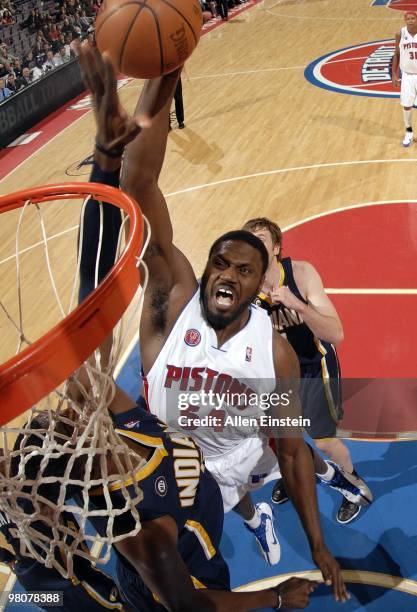 Jason Maxiell of the Detroit Pistons goes up for a dunk against Roy Hibbert of the Indiana Pacers during the game at the Palace of Auburn Hills on...