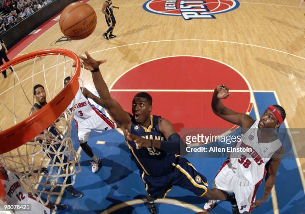 Roy Hibbert of the Indiana Pacers shoots a layup against Kwame Brown of the Detroit Pistons during the game at the Palace of Auburn Hills on March...