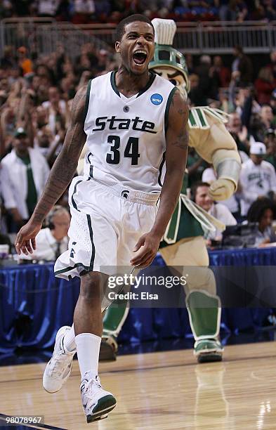 Korie Lucious of the Michigan State Spartans celebrates the win during the midwest regional semifinal of the 2010 NCAA men's basketball tournament at...