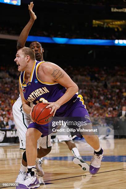 Jordan Eglsesder of the Northern Iowa Panthers drives to the basket against the Michigan State Spartans during the midwest regional semifinal of the...