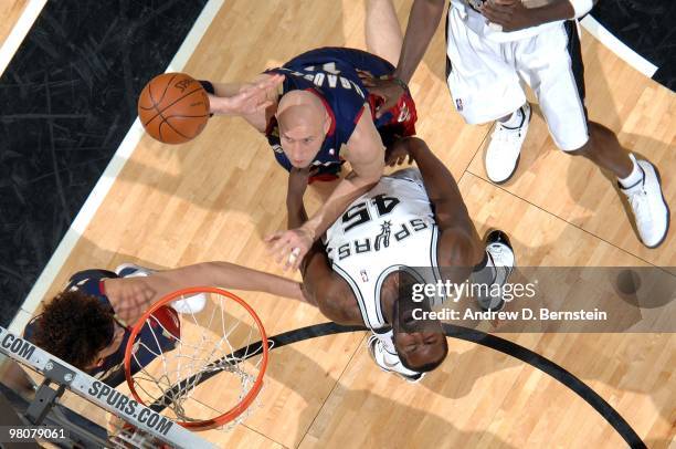 Zydrunas Ilgauskas of the Clavaland Cavaliers puts up a shot over DeJuan Blair of the San Antonio Spurs at the AT&T Center on March 26, 2010 in San...