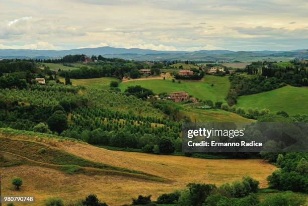 landscape of hills in siena outskirts, siena, tuscany, italy - radice stock pictures, royalty-free photos & images