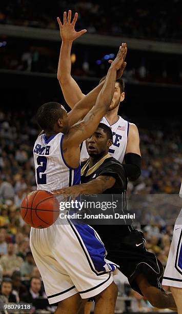 Twaun Moore of the Purdue Boilermakers passes around Nolan Smith of the Duke Blue Devils during the south regional semifinal of the 2010 NCAA men's...