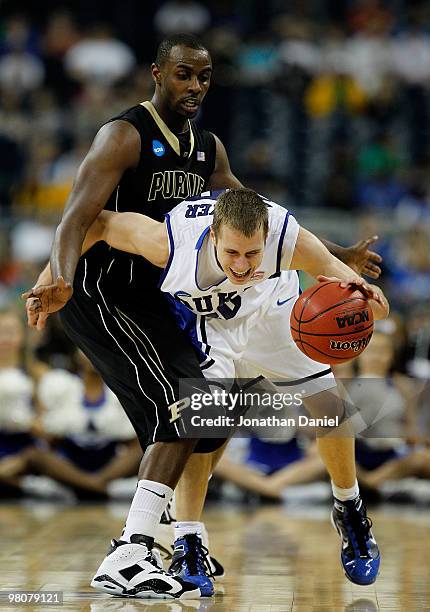 Keaton Grant of the Purdue Boilermakers fouls Jon Scheyer of the Duke Blue Devils during the south regional semifinal of the 2010 NCAA men's...