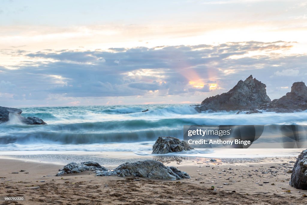Rough ocean at sunset, Carnewas and Bedruthan Steps, Cornwall, England, UK