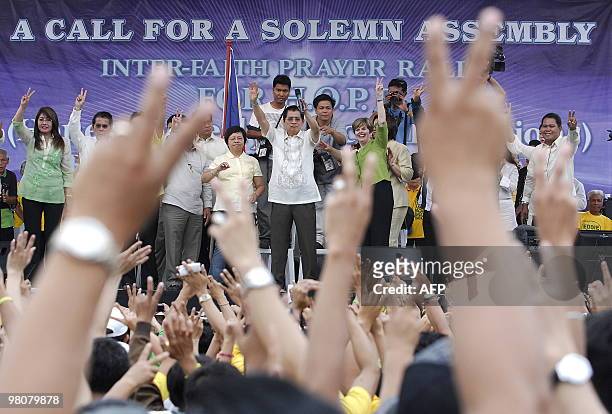 Philippine presidential candidate Eddie Villanueva waves to the crowd during a prayer rally at Luneta, in Manila, on March 27, 2010. Fifty million...