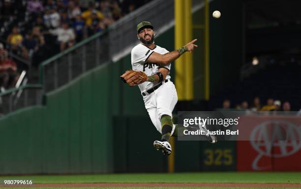 Sean Rodriguez of the Pittsburgh Pirates throws to first base for a force out of Jarrod Dyson of the Arizona Diamondbacks in the seventh inning...